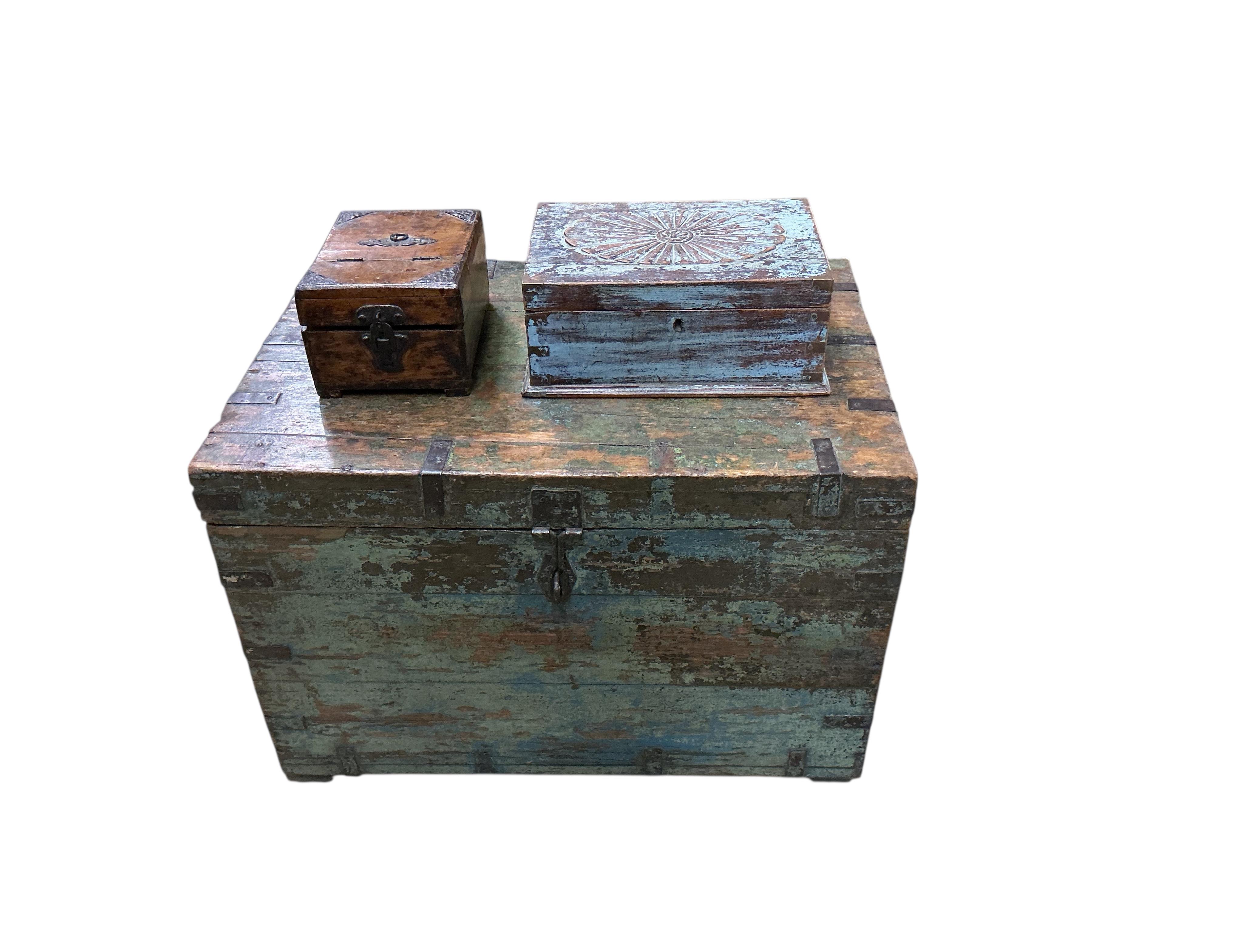 A painted iron bound hardwood trunk, width 66cm, depth 44cm, height 47cm together with two small boxes